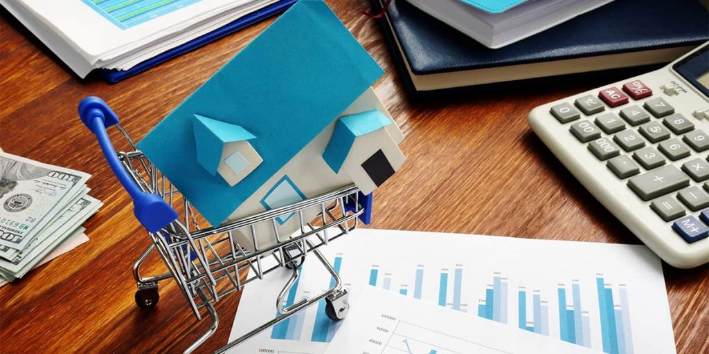 Toy house in shopping cart - What You Should Consider Before Buying An Investment Property